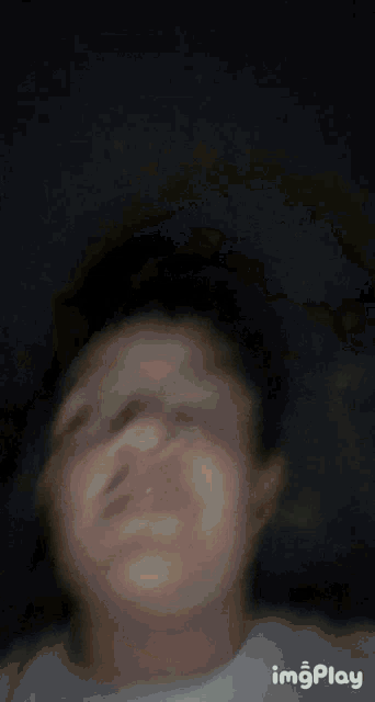 a close up of a person 's face with the words imgplay below