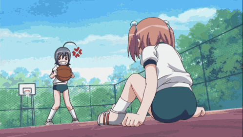 a girl is holding a basketball while another girl stands behind her