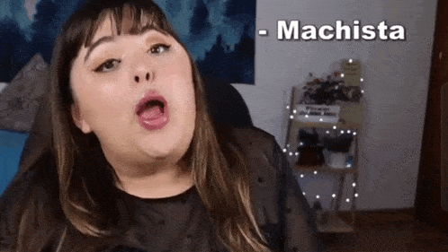 a woman is making a funny face with the word machista behind her