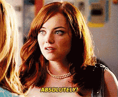 a woman with red hair and a pearl necklace says " absolutely "