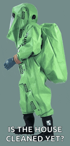 a person wearing a green hazmat suit with the words is the house cleaned yet