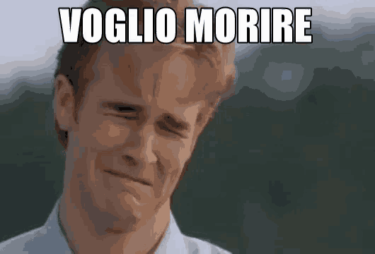 a man in a white shirt is making a sad face with the words voglio morire written above him .