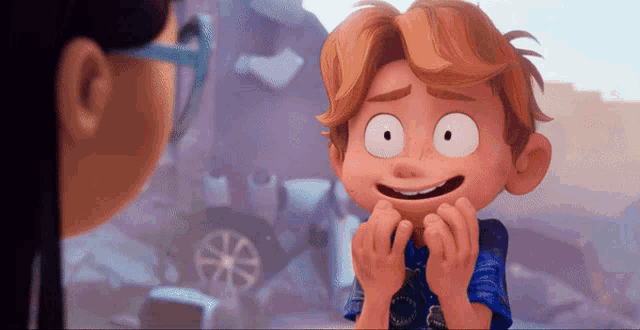 a boy in a blue shirt is smiling in front of a girl