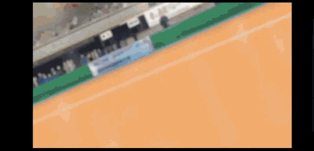 a blurred image of a tennis court with a sign that says ' allianz ' on it