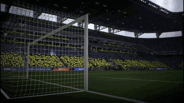 a soccer stadium with a fifa.com advertisement