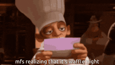 a man in a chef 's hat is reading a letter that says mfs realizing that it 's waffle night .