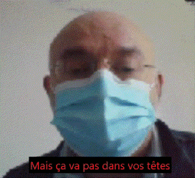 a man wearing a face mask and glasses with the words mais ca va pas dans vos tetes written below him .