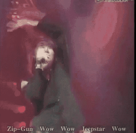 a man is singing into a microphone with the words zip-gun wow wow jeepstar wow written on the bottom