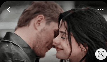 a man and a woman are touching their foreheads