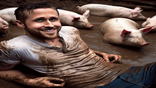 a man is laying in the mud with pigs