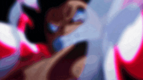 a blurred image of a person holding a remote control