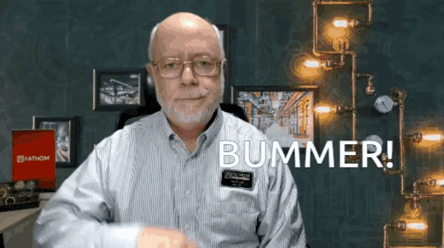a bald man with glasses and a name tag that says bummer on it