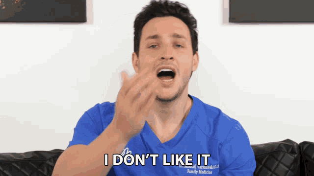 a man in a blue shirt that says i don t like it