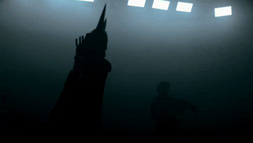 a silhouette of a person standing in the dark