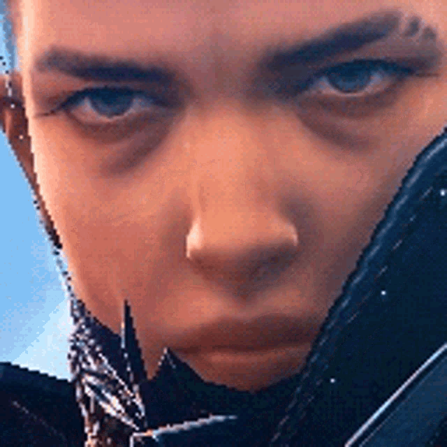 a close up of a person 's face with a sword