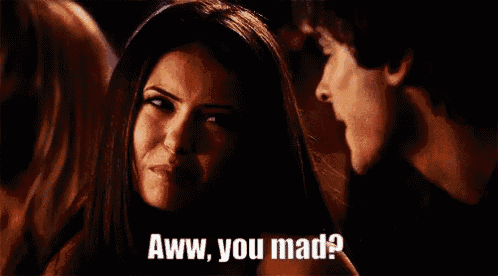 a man and a woman are sitting next to each other and the woman is saying `` aww , you mad ? '' .