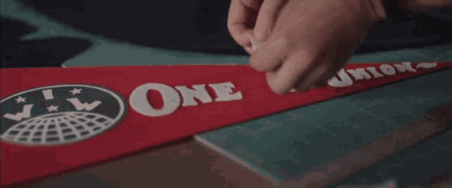 someone is making a pennant with the word one on it