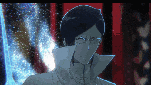 a man with glasses is standing in front of a blue and red background
