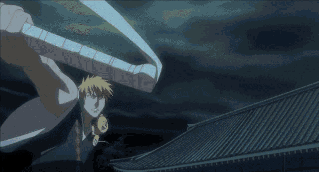 a man in a black shirt is holding a sword in the dark