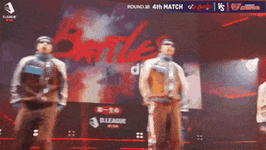 a group of people are dancing in front of a large screen that says battle