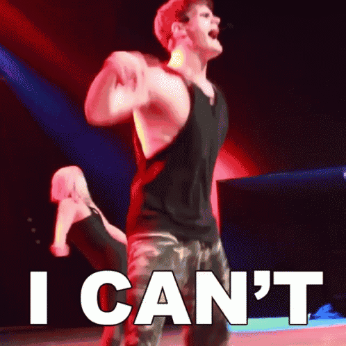 a man in a black tank top is dancing with a woman behind him and the words i can 't behind him