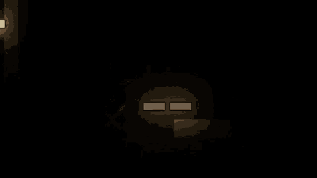 a dark room with a few lights on and a clock on the wall