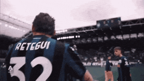 a man in a striped jersey with the number 32 on it