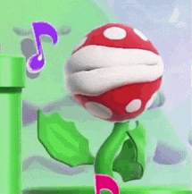 a red and white plant with a purple note behind it is standing next to a green pipe .