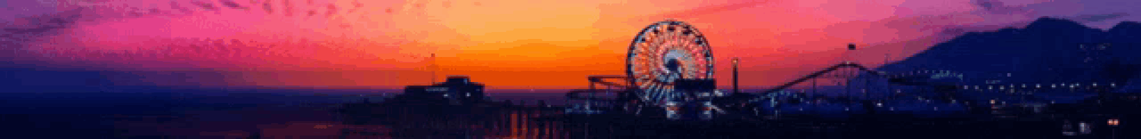 a ferris wheel and roller coaster are silhouetted against a sunset sky .