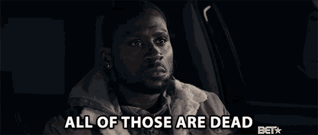 a man in a car with the words all of those are dead behind him