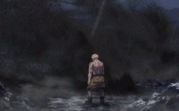 a man in a loincloth is standing in a body of water