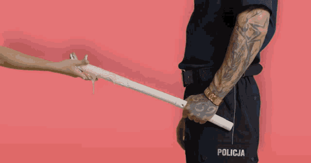 a police officer has a tattoo on his arm