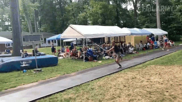 a group of people are sitting under tents in a park with failarmy written on the bottom right