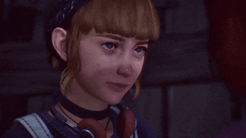 a girl wearing headphones and a choker is crying .