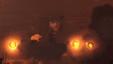 a man holding a gun with the words someone is dying in the background