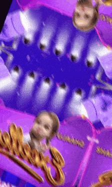 a close up of a purple and gold sign that says ' shimmer ' on it