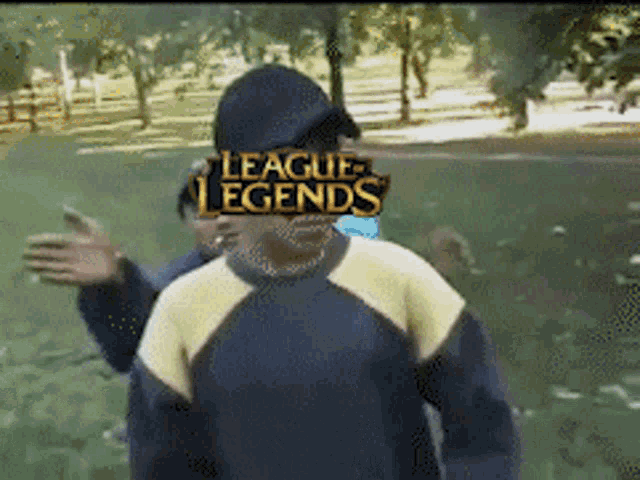 a man with a league of legends logo covering his face