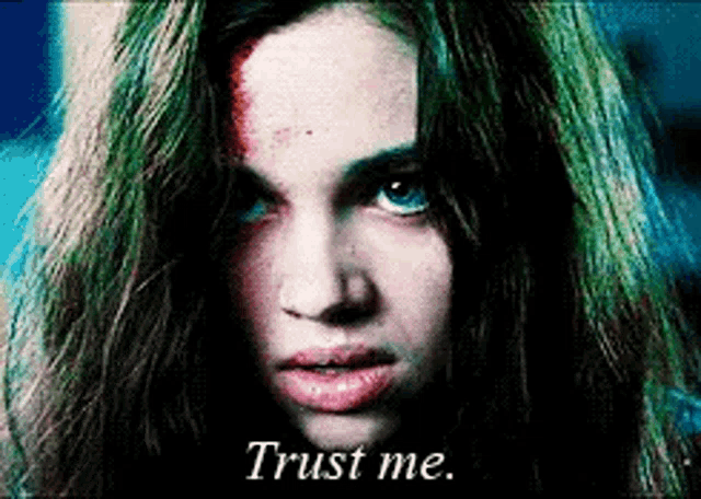 a close up of a woman 's face with the words trust me on the bottom