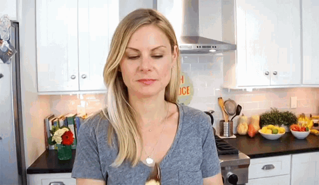 a woman in a kitchen with a sign that says ice