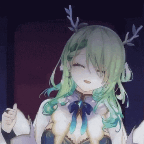 a close up of a girl with green hair and antlers .