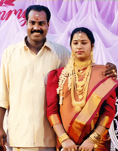 a man and a woman pose for a picture in front of a sign that says ' marriage '