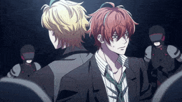 a man with red hair is standing next to another man