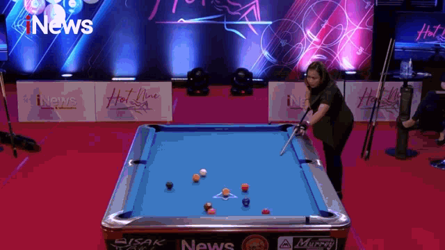 a pool table with a sign that says hot nine on it