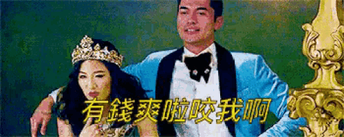 a man in a tuxedo and bow tie is standing next to a woman wearing a tiara