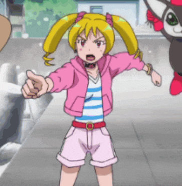 a girl in a pink jacket and pink shorts is pointing