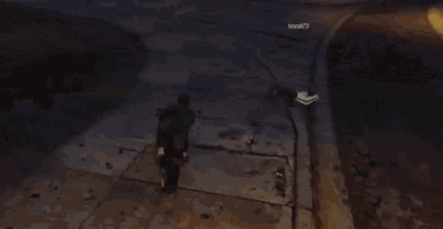 a person riding a motorcycle in front of a rogers scrap sign