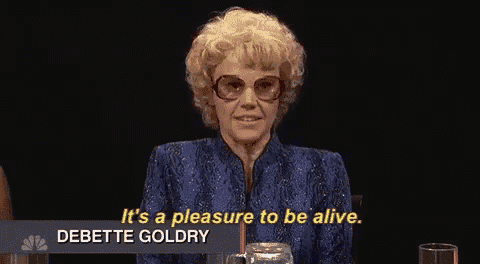 a woman with blonde hair and glasses says it 's a pleasure to be alive
