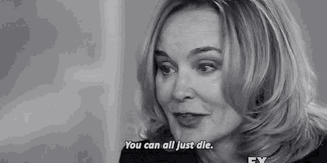 a black and white photo of a woman talking and saying `` you can all just die . ''