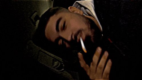 a man laying down with his eyes closed