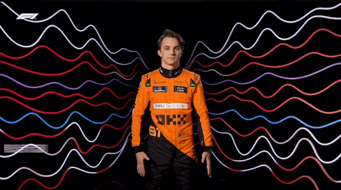 a man in an orange racing suit is standing in front of a colorful background that says australian cricket